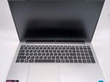 an open laptop computer sitting on top of a white table