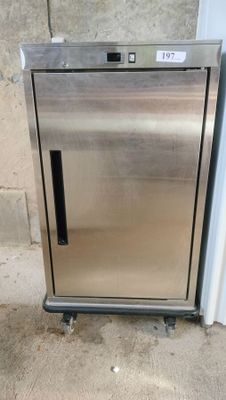 a stainless steel refrigerator sitting outside of a building
