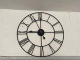 a clock on the wall above a doorway in a building