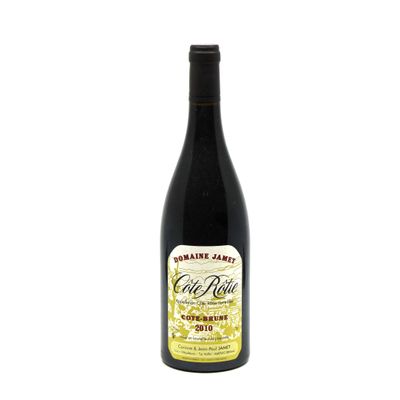a bottle of wine sitting on top of a white table