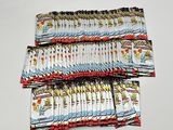 a lot of small packets of candy sitting on a table