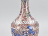 an image of a blue and white vase with a bird on it
