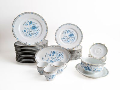 a lot of blue and white plates and cups and saucers
