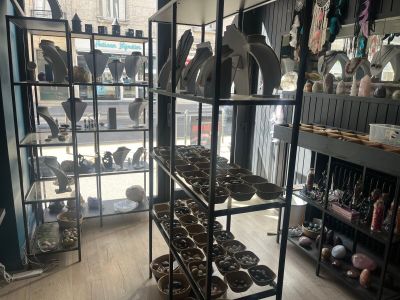 a room with a lot of different items on the shelves
