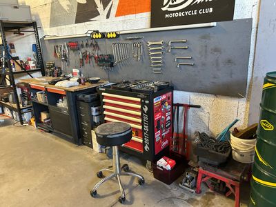 a garage with a lot of tools and tools on the wall