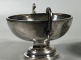 pair of silver plated bowls with handles on pedestal