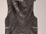 an image of a leather vest hanging on a wall