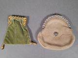 two small purses that are sitting on a table