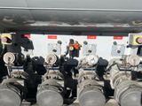 a lot of pipes that are connected to the back of a truck