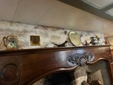a fireplace in a room with a lot of items on top of it