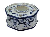a blue and white octagonal shaped box with flowers on it