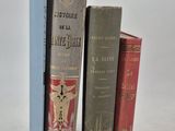 three books that are sitting next to each other on a table