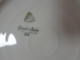 a white plate with a picture of a tree on it