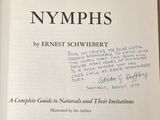 an open book with a handwritten title on it