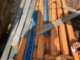 a large pair of scissors sitting on top of a pile of wood
