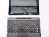 a tablet computer sitting next to a laptop computer