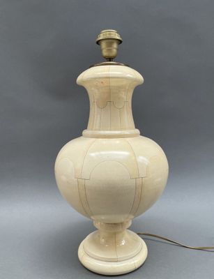 an image of a white vase with a light on top of it