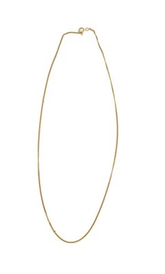a gold necklace with a long chain on a white background