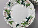 a lot of plates that are sitting on a table