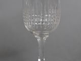 an empty wine glass sitting on top of a table