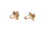 pair of gold plated stud earrings with a diamond center