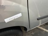 a sticker on the side of a gray truck