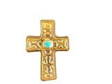 gold cross with turquoise stone in center on white background