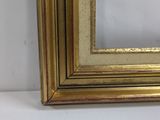 a gold frame with a white background and a gold border