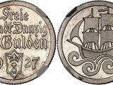 a close up of a coin with a ship on it