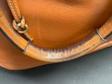 a close up of a brown bag with a handle