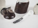 three different types of vases and a spoon on the table