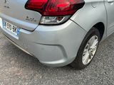 a silver car parked on the side of the road