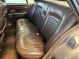 a brown leather seat in the back of a car