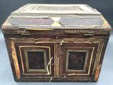 an old wooden box with two doors on the inside of it