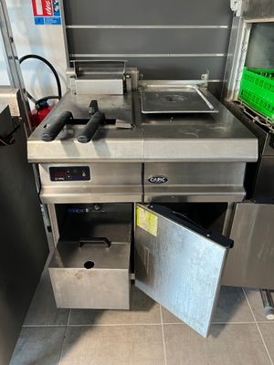 an image of a commercial kitchen with stainless steel appliances