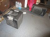 two speakers that are sitting next to each other on the floor