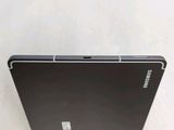 a black laptop that is sitting on a white surface
