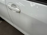 a close up of a car door handle with a sticker on it