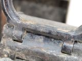 a close up of a metal object with a handle on it