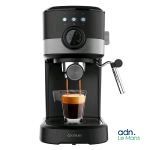 a close up of a coffee maker with a cup of coffee