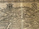 an old map of a town with a river running through it