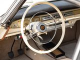 a steering wheel and dashboard of an old car