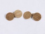 a pair of gold tone cufflinks with a geometric design