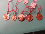 many different types of medals on a blue table