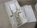 a box that has a charger and a cable in it