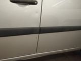 a white car with a black stripe on the side of it