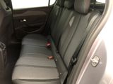 the back seats of a car with a seat belt in the back of it