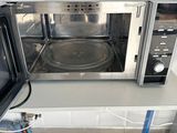 a microwave that is sitting on a counter in a kitchen