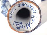 a blue and white vase with writing on it