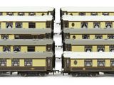 two trains that are sitting side by side on the tracks
